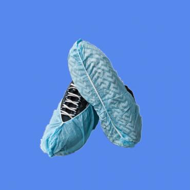 Disposable nonwoven anti-skid shoe covers